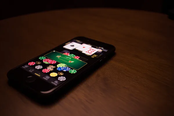 A confident dealer surrounded by casino chips inviting players to access their TKPK account, reflecting quick and easy login options.